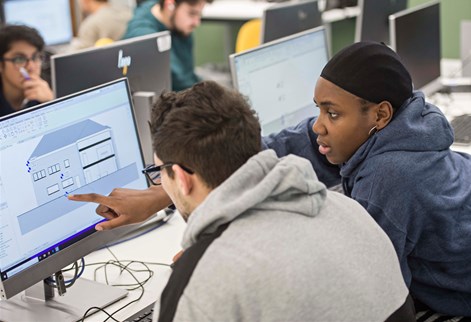 Students studying architectural diagrams on the computer