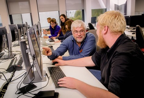 Students studying geological computer models