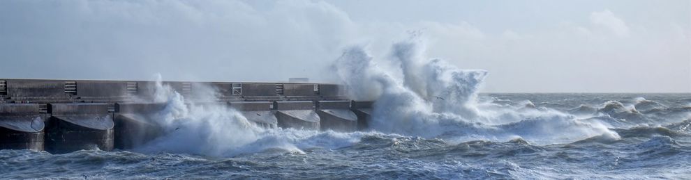 Waves crashing against Brighton sea wall