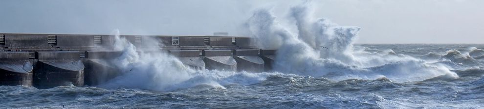 Waves crashing in storm against Brighton sea wall