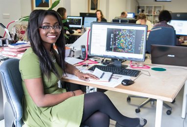 Smiling student working on an architectural technology placement