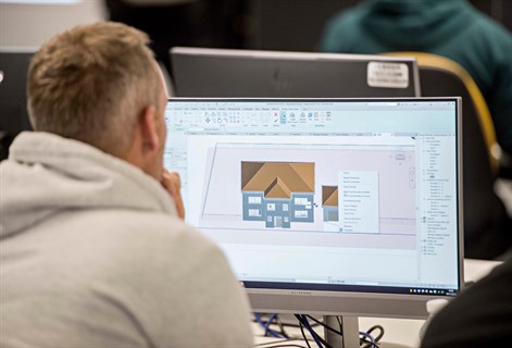 student looking at computer screen using BIM