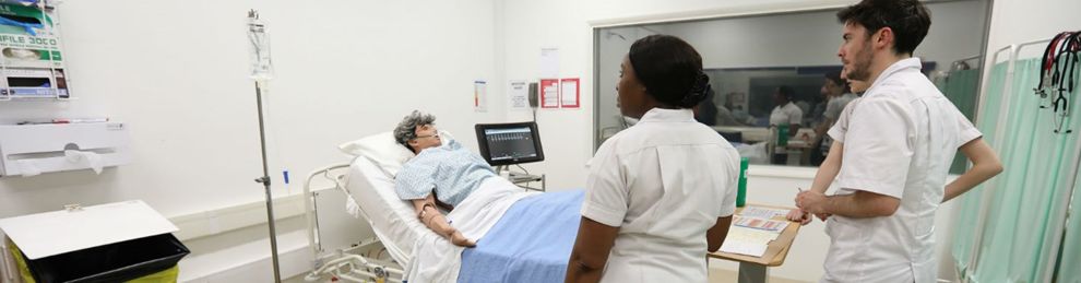 student in the clinical suite with a mannequin