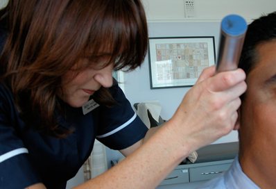General practice nurse with a patient