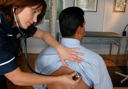 General practice nurse with a patient