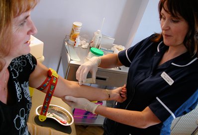 General practice nurse with a patient