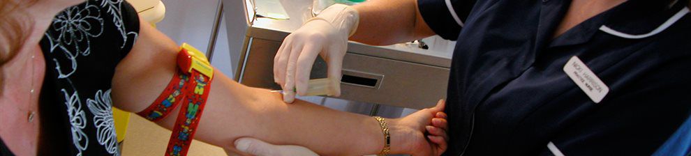 Photograph of a general practice nurse taking bloods from a patient's arm