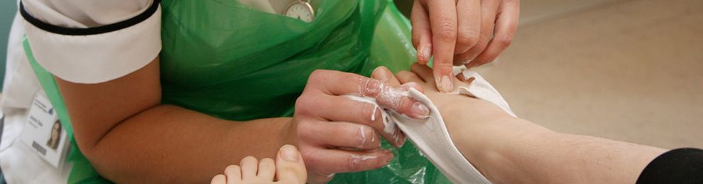 Podiatrist examining a foot