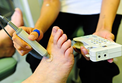 Podiatrist examining a foot