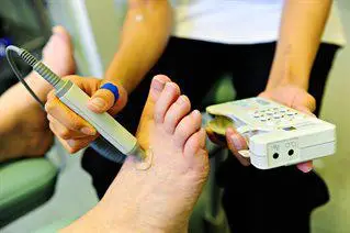 Podiatrist examining a foot