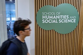 school of humanities and social science sign on wall
