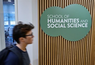 school of humanities and social science sign on wall