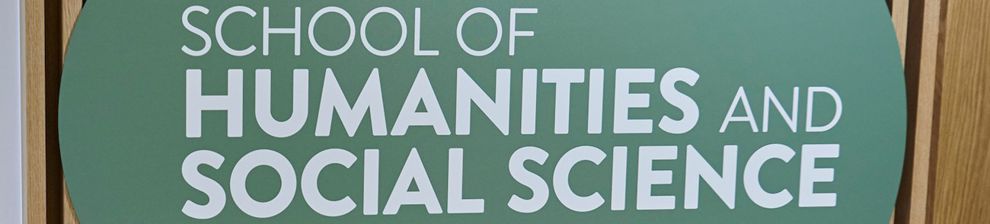 school of humanities and social science sign on wall