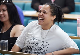 smiling HSS students in lecture theatre