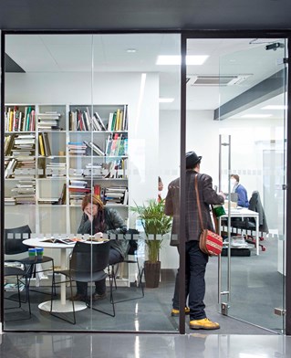 Glass door into a room with books