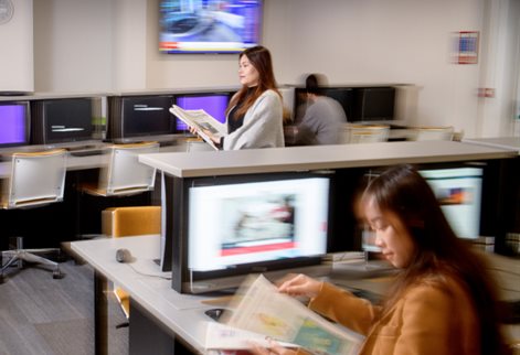 Female journalist in news room