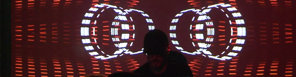 DJ in front of visual display
