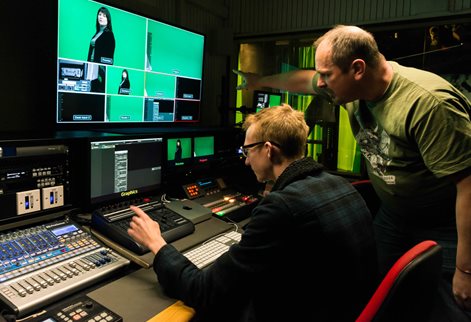 Media staff helping out in the media studio