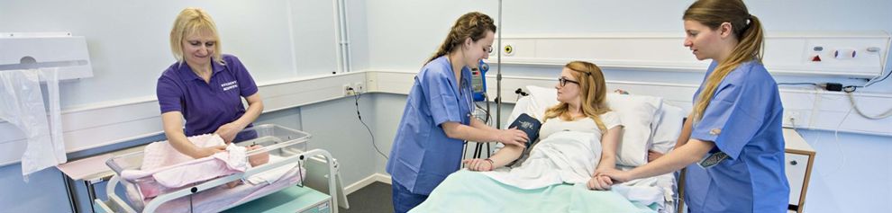 Nursing students demonstrating with peer