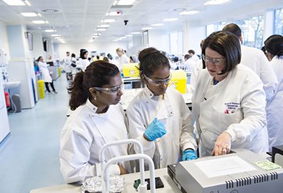 Students being supervised by a lecturer in the lab