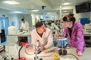 Two students working together in a chemistry lab