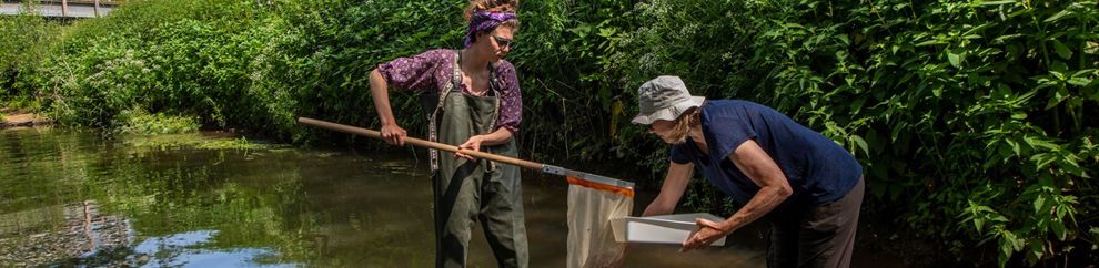 Two students using river equipment