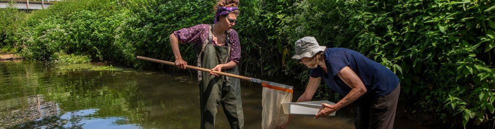 Two students using river equipment