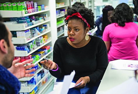 Graduates working in a busy pharmacy