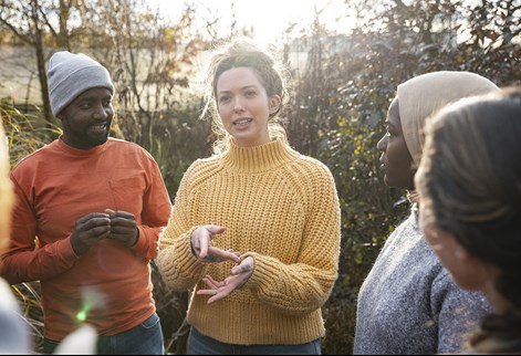 a group chatting in the countryside