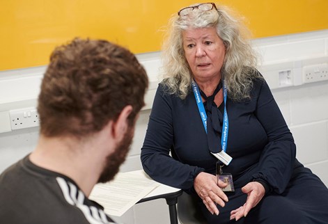 lecturer chatting with student