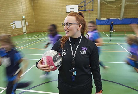 PE trainee teacher with pupils