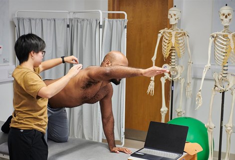 A student practising physio on another