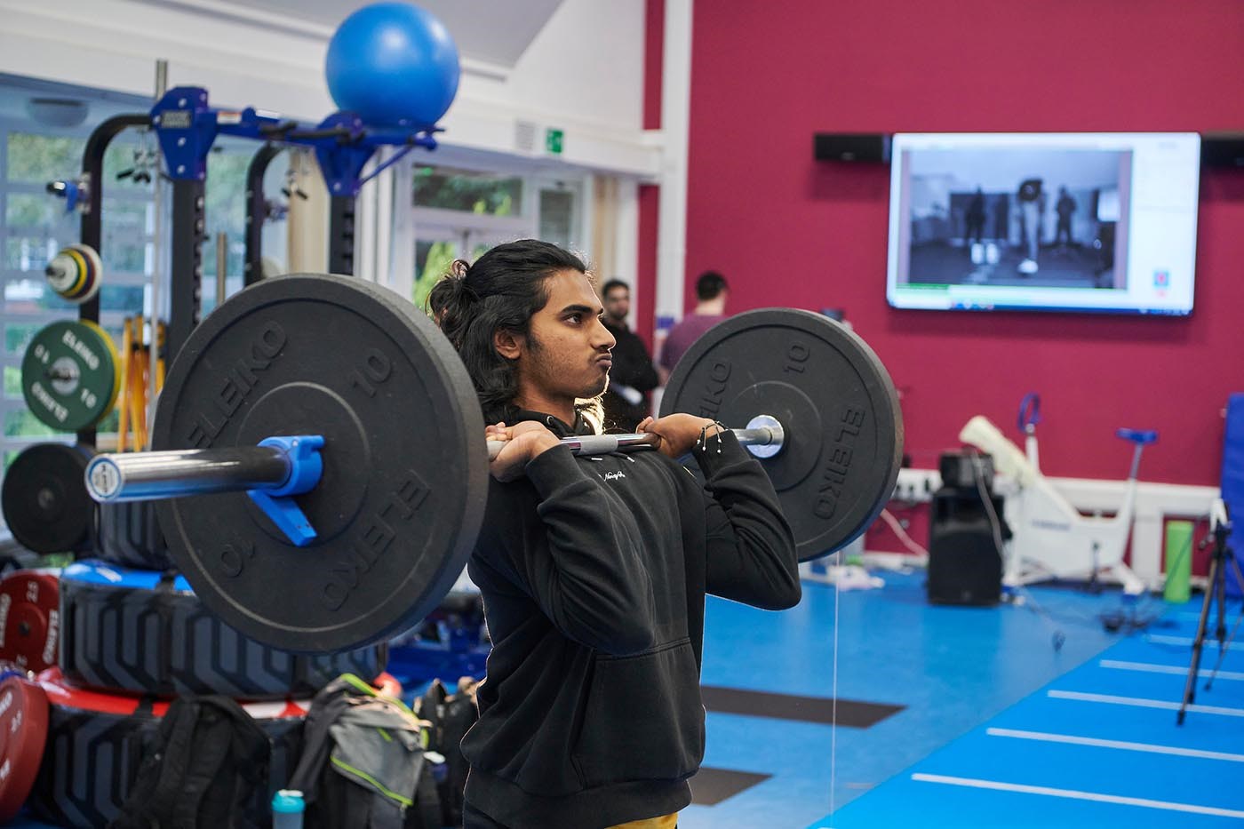 student lifting weights