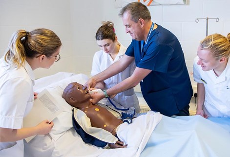 lecturer demonstrating to students