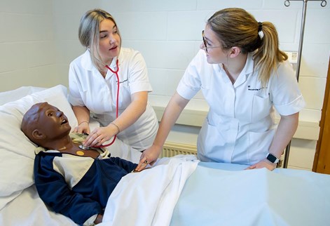 students with a child mannequin