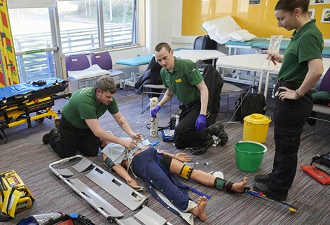 student paramedics with a mannequin