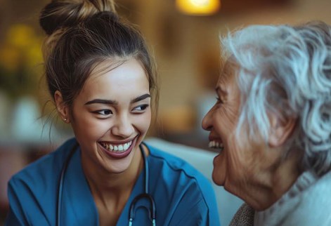 female health worker talking with an elderly woman