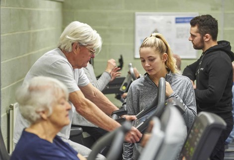 Students working with cardiac rehab clients