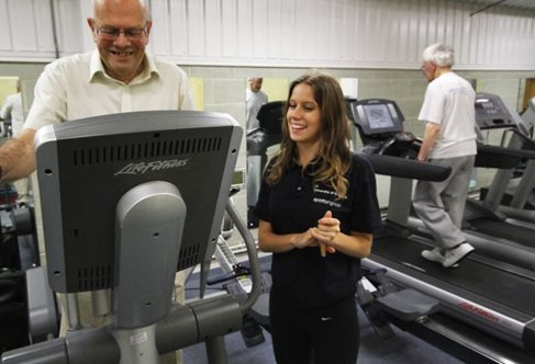 An older man on a treadmill in a sports lab