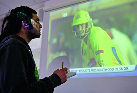 Sport Journalism student reporting on cricket