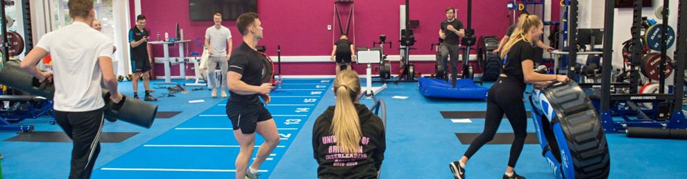 Students doing circuit training in gym