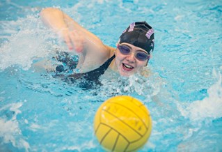 Swimmer playing water polo