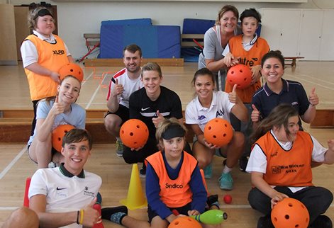 students on an inclusive sports day with local children