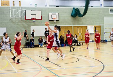 Students playing basketball