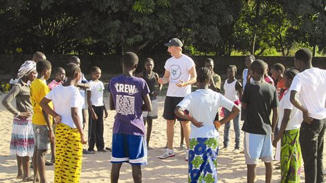 student and children on the beach