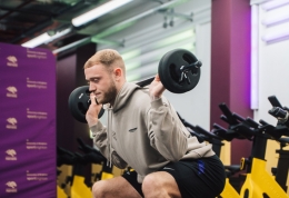 Person squat lifting weights