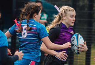 Girls Rugby team playing a match