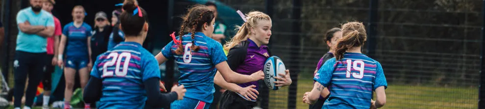Girls rugby team playing a game