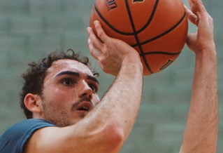 Student playing basket bal