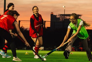 Girls hockey team playing a match